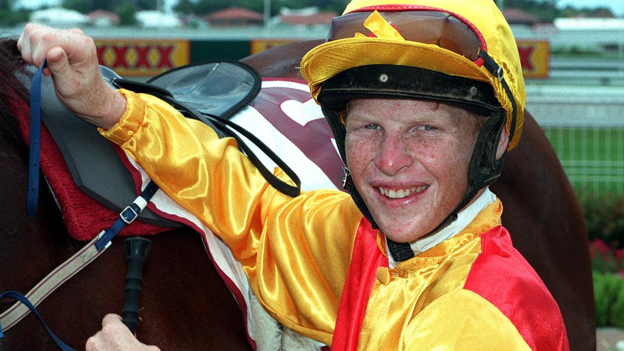 1 Feb 1997 DOOMBEN RACE 1 WINNER... BOLD GENIUS BEING UNSADDLED BY  JOCKEY.. TOM BUTTON alone headshot smiling sport horseracing qld