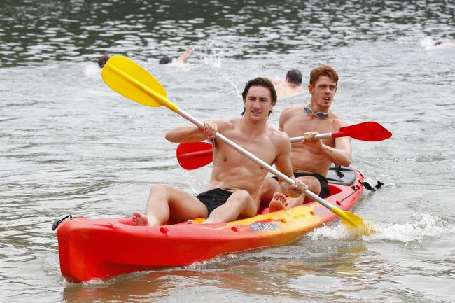 Gold Coast Suns players Jez McLennan (back) and Sam Fletcher training at Palm Beach. Picture: Tertius Pickard