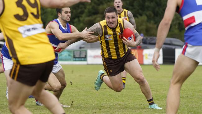 EFL: Rowville’s Anthony Brolic tries to beat the tackle. Picture: Valeriu Campan