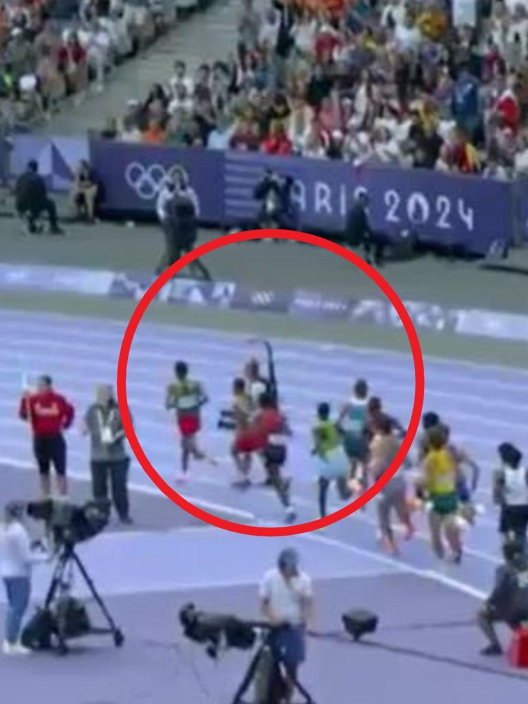 The cameraman was seemingly oblivious to the runners coming towards him. Picture: Nine