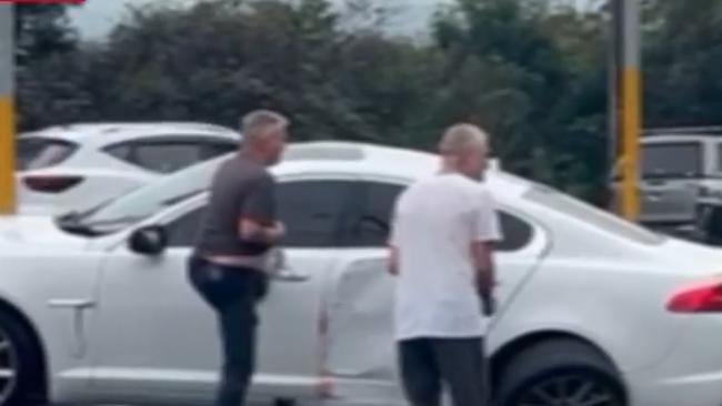 Mr Sargeant (grey t-shirt) can be seen trying to help. Mr Benson pictured in the white shirt. Picture: Nine News