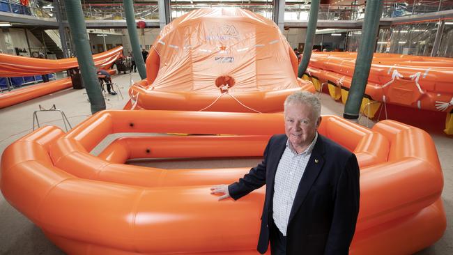 Liferaft Systems Australia Managing Director Mike Grainger with a 100 person self righting inflatable liferaft at Derwent Park. Picture: Chris Kidd