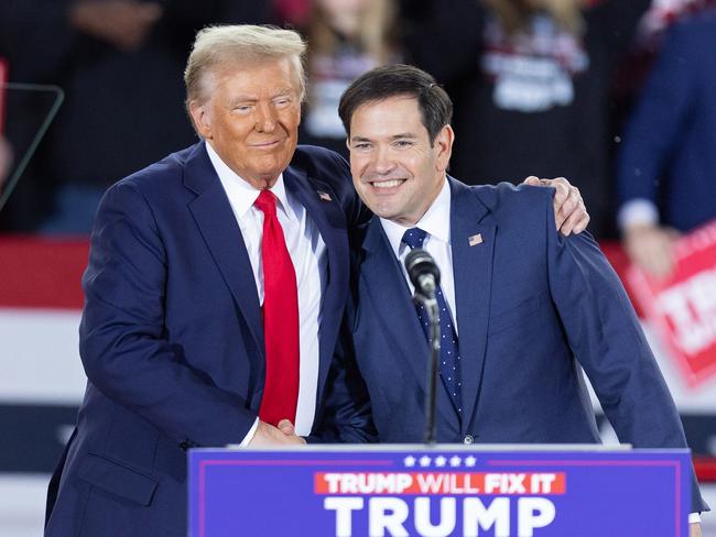 Donald Trump greets Senator Marco Rubio, Republican of Florida, during a campaign rally in Raleigh, North Carolina, on November 4. Picture: Ryan M. Kelly / AFP