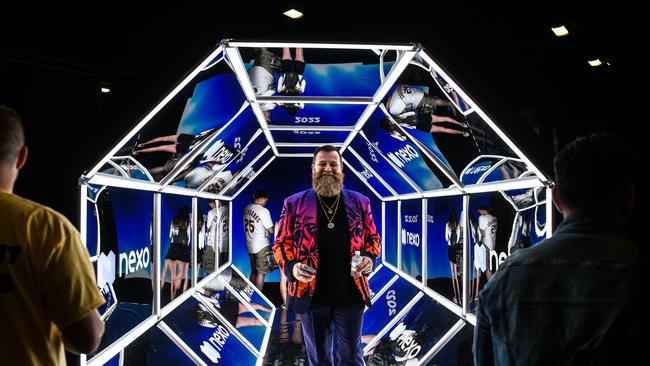 A man poses in a Bitcoin-themed art installation during a conference in Miami this month. Cryptocurrency ETFs want to offer investors the chance to directly invest in bitcoin without the need for a digital wallet. Picture: AFP