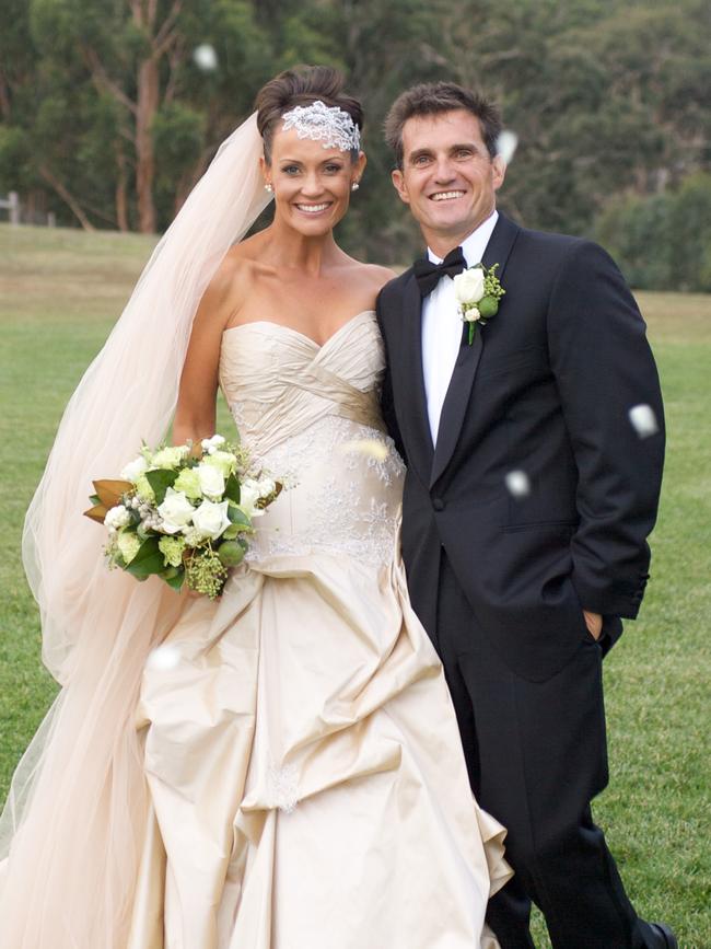 Jo Fincham and husband Rob Hodges on their wedding day. They met on TV program 'The Farmer Wants a Wife'.