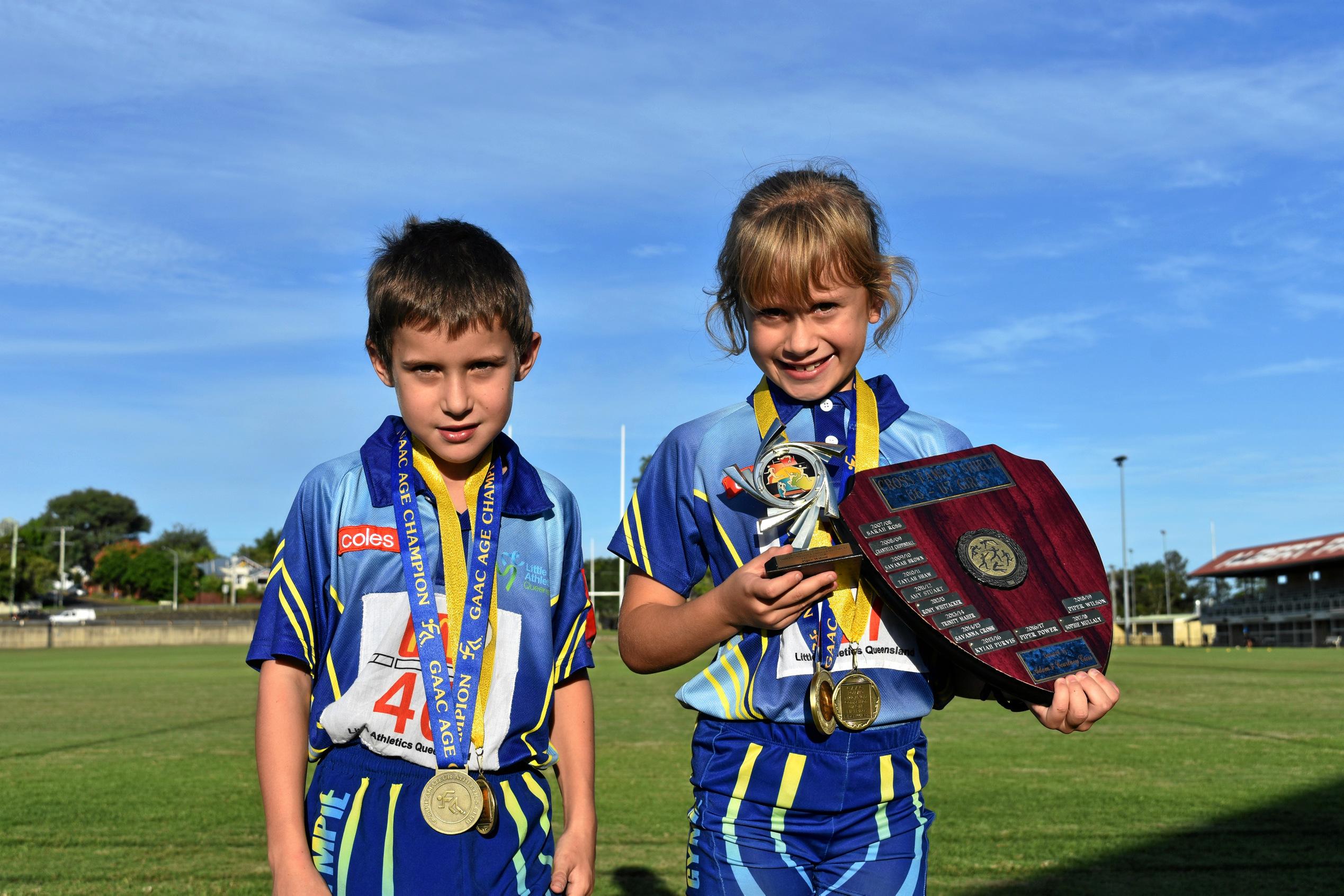 Athletics - Under 7 boys age champion and Friday Night Competition under 7 boys winner Hunter Jacobson and under 7 girls age champion, Adam and Courtney Cross Shields winner under 7 and Friday Night competition winner Piper Wilson. Picture: Bec Singh