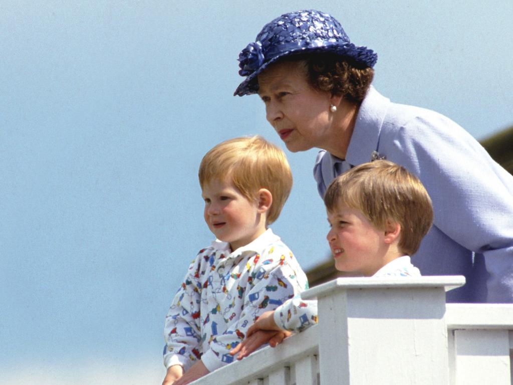 The Queen with grandsons Prince William and Prince Harry in the Royal Box at Guards Polo Club, Smiths Lawn, Windsor. Picture: Tim Graham Photo Library via Getty Images