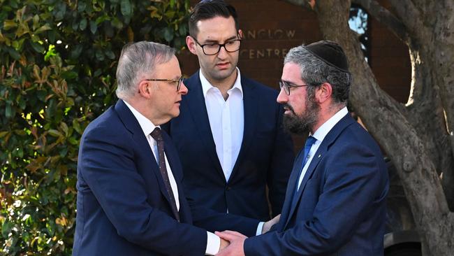 Prime Minister Anthony Albanese (left) and Labor member for MacNamara Josh Burns greeted by Rabbi Yaakov Glasman (right) during a visit to the St Kilda Shule in Melbourne.