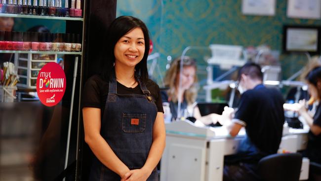 Nguyet Vu outside Nail Lovers, one of the businesses that has benefited from the myDarwin local voucher scheme. Picture: Glenn Campbell