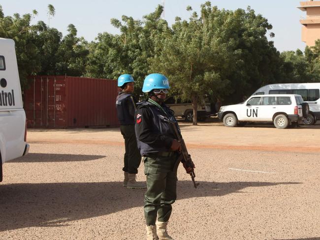 UN peacekeepers standing guard near Timbuktu's airport where a rocket and car bomb attack left one UN peacekeeper dead, a dozen wounded. Picture: AFP Photo