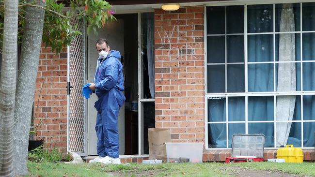 Investigators on the crime scene at Reeves St, Narara. Picture: Sue Graham