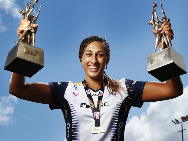 Lightning Captain and Goal Keeper Geva Mentor proudly holds aloft their back to back Super Netball Trophys. Photo Lachie Millard