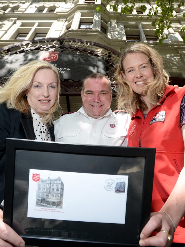 Australia Post boss Christine Holgate with the Salvation Army's Brendan Nottle and Tameka Buckley at the charity's Bourke Street building. Picture: Andrew Henshaw