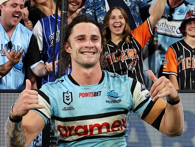 BRISBANE, AUSTRALIA - MAY 18: Nicho Hynes of the Sharks poses with the crowd as he celebrates victory during the round 11 NRL match between Cronulla Sharks and Sydney Roosters at Suncorp Stadium, on May 18, 2024, in Brisbane, Australia. (Photo by Hannah Peters/Getty Images)