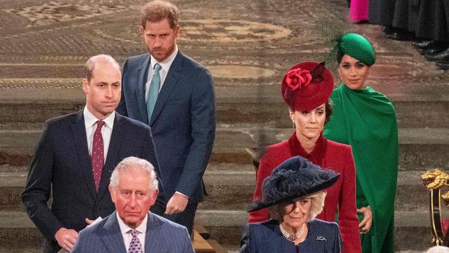 A stony faced Harry with William, Meghan, far right, Kate, Prince Charles and Camilla at the Commonwealth Service in London, a year ago. Picture: AFP