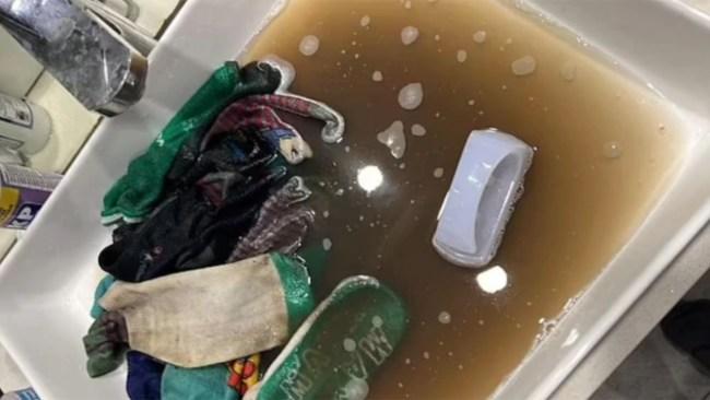 A mum took freshly clean socks and soaked and scrubbed them turning the water a filthy brown. Photo: Facebook