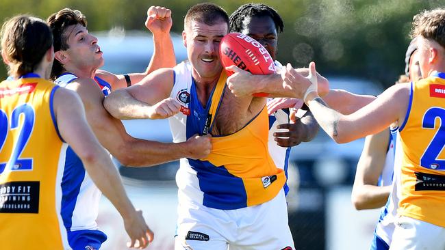 Jake Chiminello battles for the ball for Macleod. Picture: Josh Chadwick