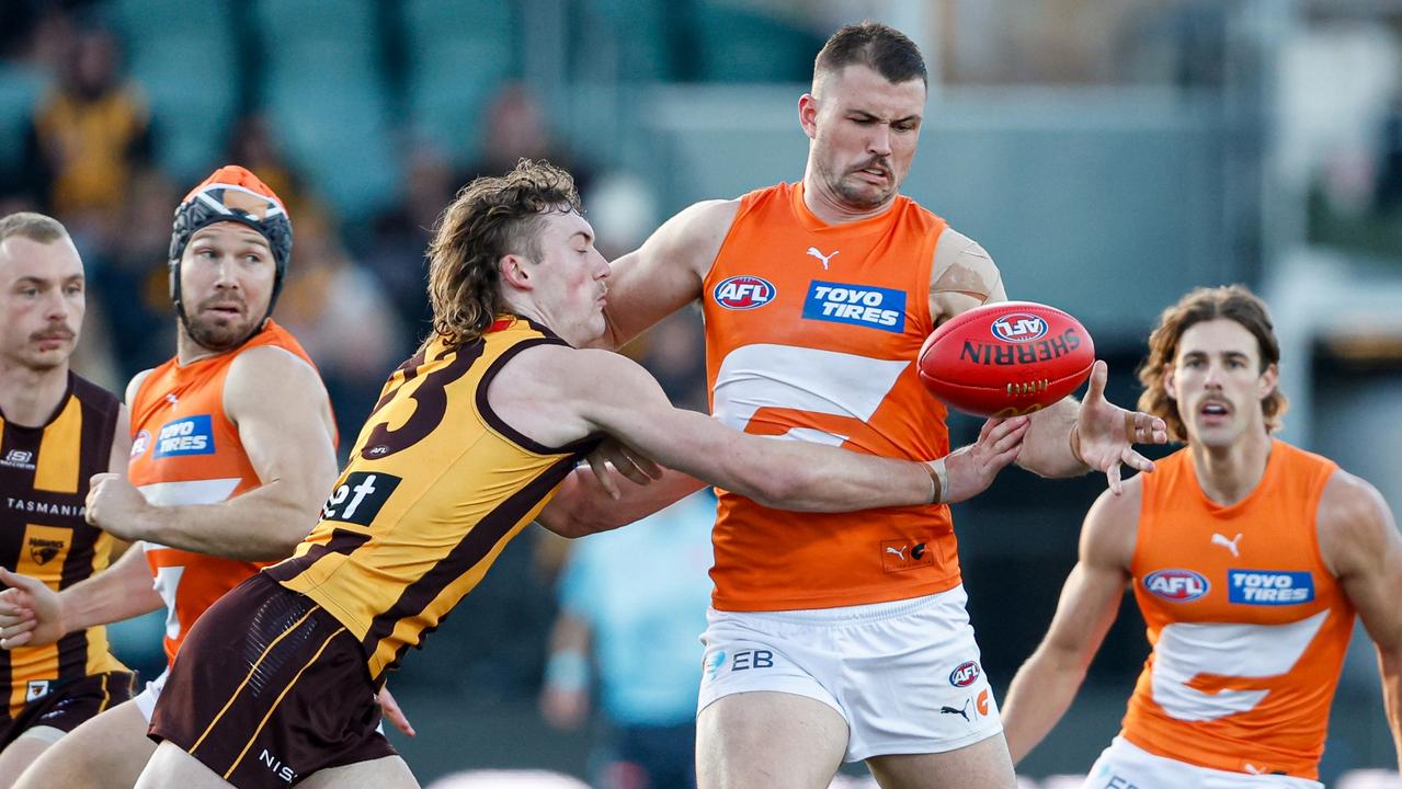 MELBOURNE, AUSTRALIA - JUNE 08: Kieren Briggs of the Giants is tackled by Josh Weddle of the Hawks during the 2024 AFL Round 13 match between the Hawthorn Hawks and the GWS GIANTS at UTAS Stadium on June 08, 2024 in Launceston, Australia. (Photo by Dylan Burns/AFL Photos via Getty Images)