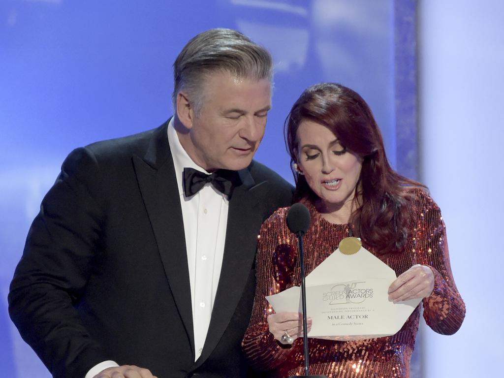 Alec Baldwin, left, and Megan Mullally present the award for outstanding performance by a male actor in a comedy series at the 25th annual Screen Actors Guild Awards. Picture: AP