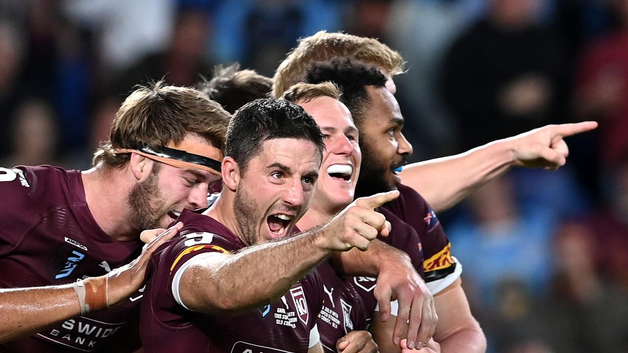 GOLD COAST, AUSTRALIA - JULY 14: Ben Hunt of the Maroons celebrates with team mates after scoring his second try during game three of the 2021 State of Origin Series between the New South Wales Blues and the Queensland Maroons at Cbus Super Stadium on July 14, 2021 in Gold Coast, Australia. (Photo by Bradley Kanaris/Getty Images)