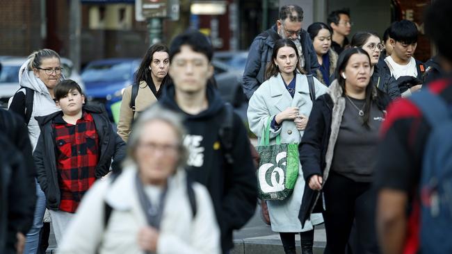 SYDNEY, AUSTRALIA - NewsWire Photos JULY 17, 2024:  Pedestrians crossing Elizabeth street   in the Sydney CBD. The Australian Bureau of Statistics, (ABS) releases it's latest job figures tomorrow.  Picture: NewsWire / John Appleyard