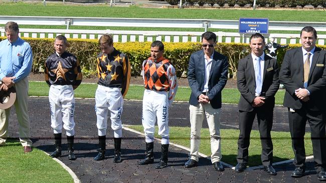 Jockey Vishan Venkaya (fourth from the right) has been injured at the Gold Coast Turf Club.