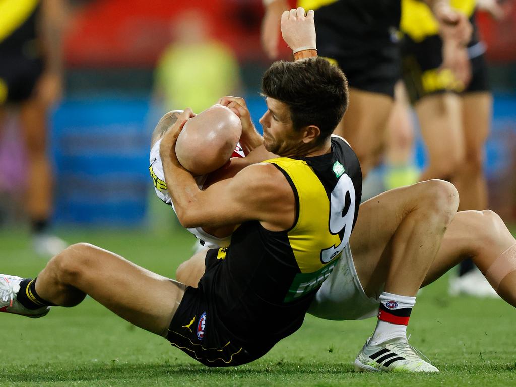 Trent Cotchin rips Zak Jones around the neck. (Photo by Michael Willson/AFL Photos via Getty Images)