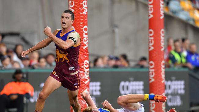 Tom Rockliff of the Lions celebrates kicking a goal during the round 21 =, 2017. (AAP Image/Darren England)