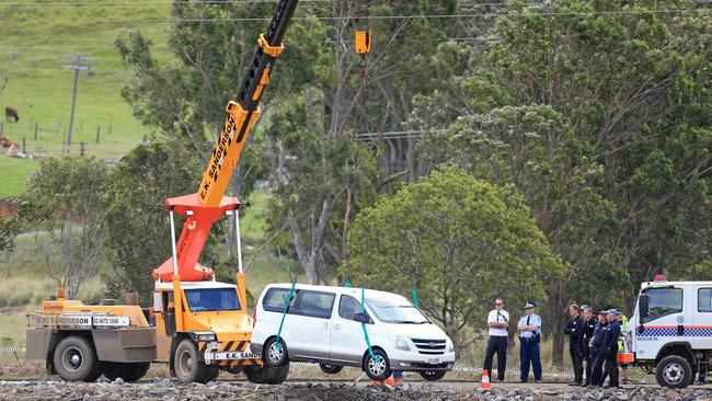 A white Hyuandai Van is lifted from the Tweed River at Tumbulgum after a 3 person fatal car accident on Monday the 3rd April 2017.POLICE have worked tirelessly to retrieve the bodies of a mother and her two children from their vehicle after it crashed into the Tweed River yesterday. Picture: SCOTT POWICK