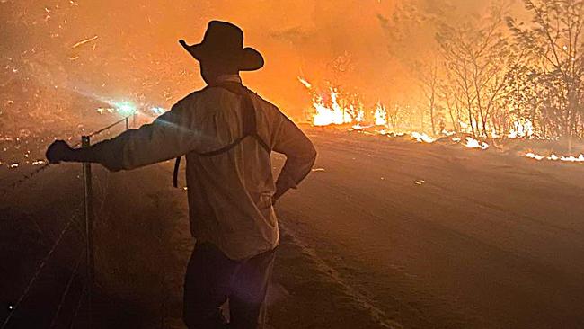 A volunteer firefighter labelled simply ‘Poster Boy’ takes a break during efforts to contain monster fire that has consumed 1200 hectares of outback bush west of Townsville in just two weeks. Picture: Torrens Creek Rural Fire Brigade