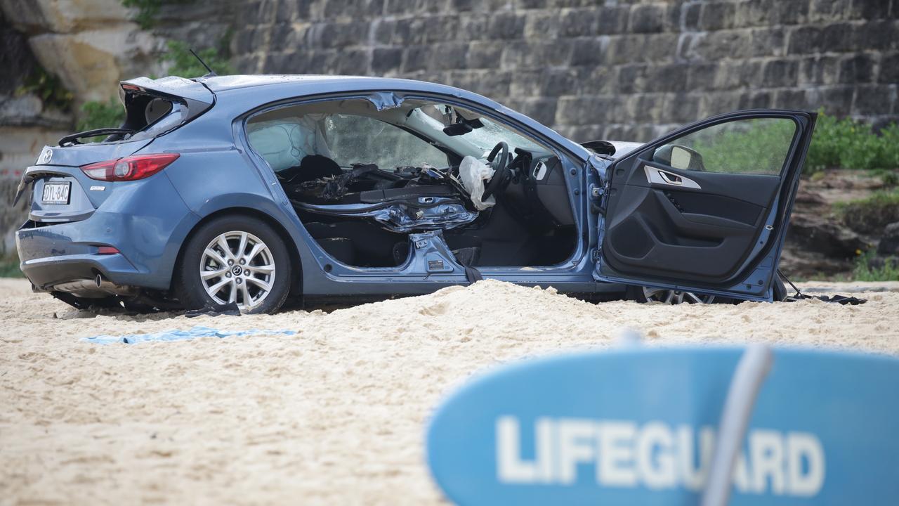 The elderly female passenger was found by rescue crews in the back of the car. Picture: Christian Gilles