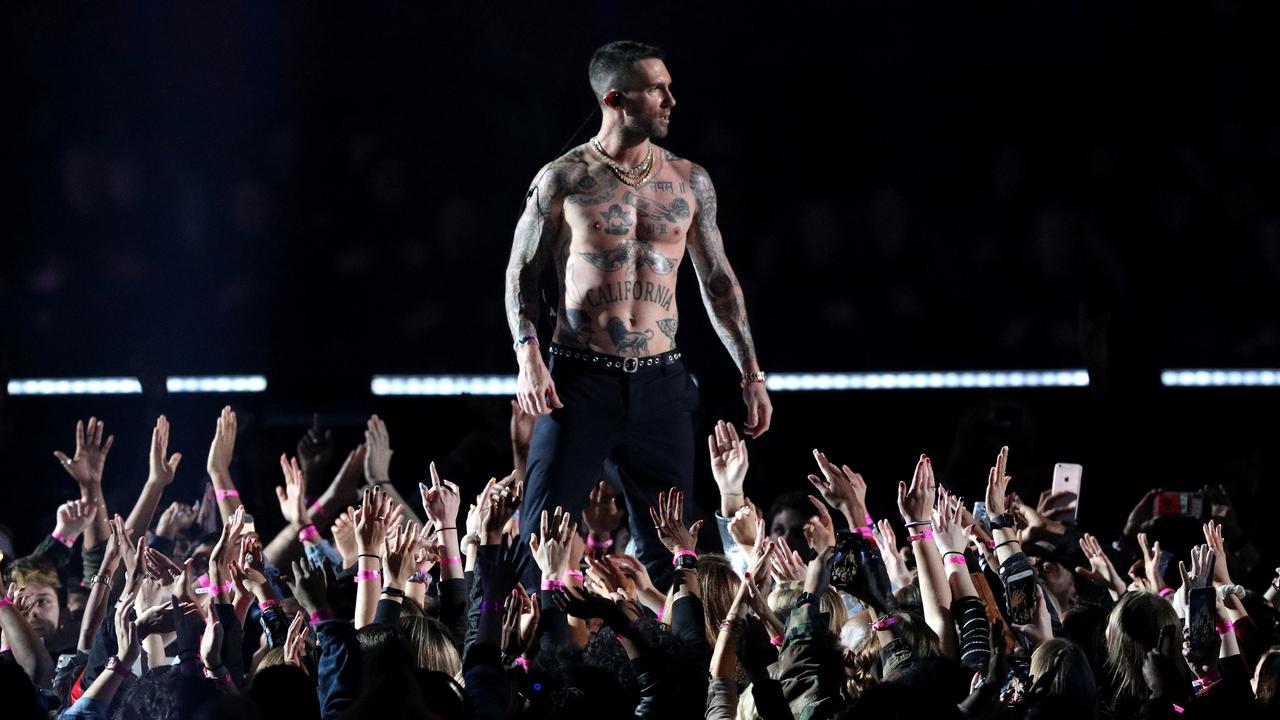 2019: Adam Levine went shirtless while playing alongside his Maroon 5 bandmates. The Guardian described their half time performance at the time as a “tedious affair”. Picture: Patrick Smith/Getty Images