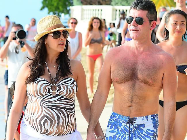 Simon Cowell and then-pregnant girlfriend Lauren Silverman.  Picture:  Splash