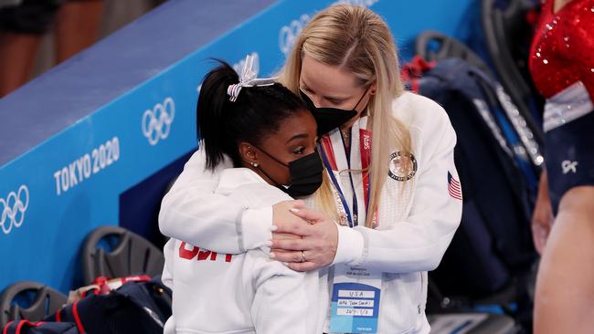 Coach Cecile Landi embraces Simone Biles after she pulled out of the team event. (Picture: Jamie Squire/Getty Images