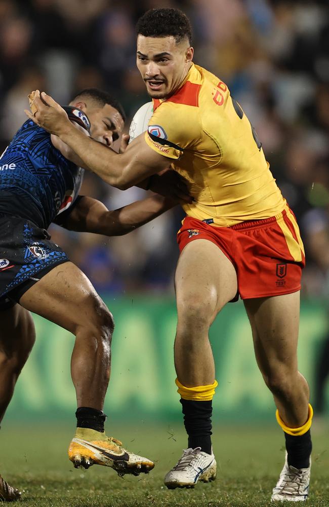 Robert Derby of Papua New Guinea runs the ball during the Test Match between Papua New Guinea and Fiji on June 25, 2022. (Photo by Mark Kolbe/Getty Images)