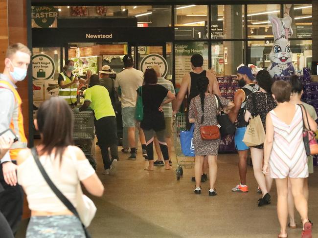 Shoppers line up out the door at Woolworths Gasworks in Brisbane’s Newstead. Picture: Liam Kidston