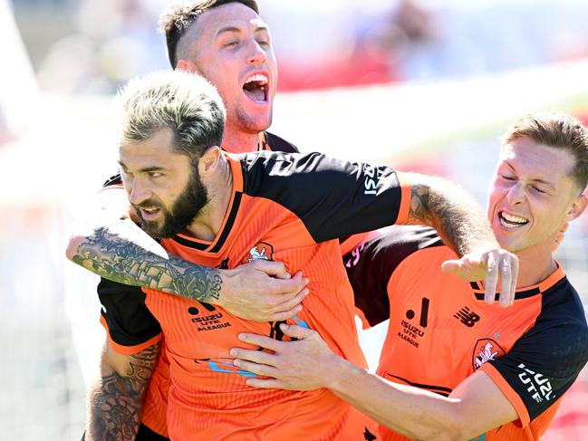 BRISBANE, AUSTRALIA - NOVEMBER 06: Charles Austin of the Roar is congratulated by team mates after scoring a goal during the round five A-League Men's match between Brisbane Roar and Sydney FC at Moreton Daily Stadium, on November 06, 2022, in Brisbane, Australia. (Photo by Bradley Kanaris/Getty Images)