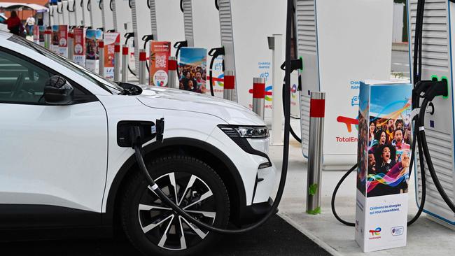 (FILES) This photograph shows charging stations for electric cars at the highway service area of Limours-Janvry, south of Paris, on August 4, 2023. Electric cars have been on the road in France this summer, and the number of recharging sessions has exploded at freeway service areas, but the charging points are still far from overloaded, on August 24, 2024. (Photo by MIGUEL MEDINA / AFP)