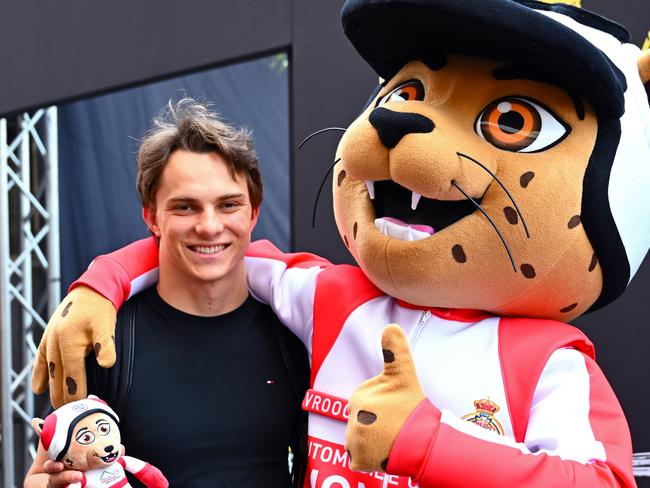 MONTE-CARLO, MONACO - MAY 22: Oscar Piastri of Australia and McLaren with the Monaco mascot during previews ahead of the F1 Grand Prix of Monaco at Circuit de Monaco on May 22, 2025 in Monte-Carlo, Monaco. (Photo by Mark Sutton - Formula 1/Formula 1 via Getty Images)