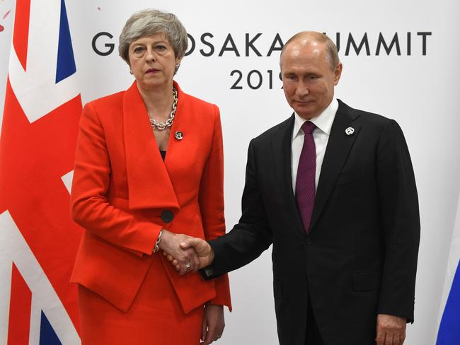 The two world leaders’ frosty handshake. Picture: STR/AFP