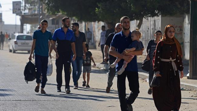 Residents in the Gaza Strip flee their homes to move away from the border with Israel. Picture: Mahmud Hams / AFP