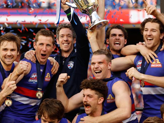 MELBOURNE, AUSTRALIA - OCTOBER 01: Bulldogs players celebrate during the 2016 Toyota AFL Grand Final match between the Sydney Swans and the Western Bulldogs at the Melbourne Cricket Ground on October 01, 2016 in Melbourne, Australia. (Photo by Adam Trafford/AFL Media/Getty Images)