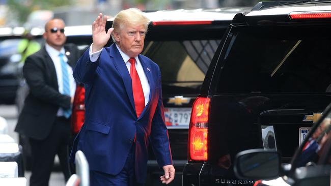 Former US President Donald Trump waves at supporters after sitting for a deposition in New York. Picture: AFP