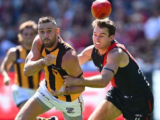 Zach Reid tracks Jack Gunston in the early stages of Saturday’s game. Picture: Quinn Rooney/Getty Images