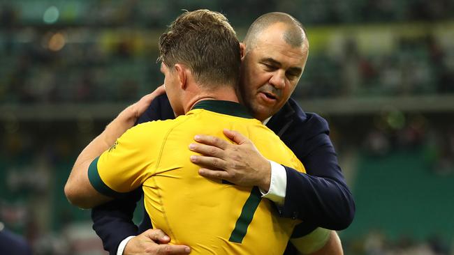 Michael Cheika hugs captain Michael Hooper after the loss. Picture: Dan Mullan/Getty Images