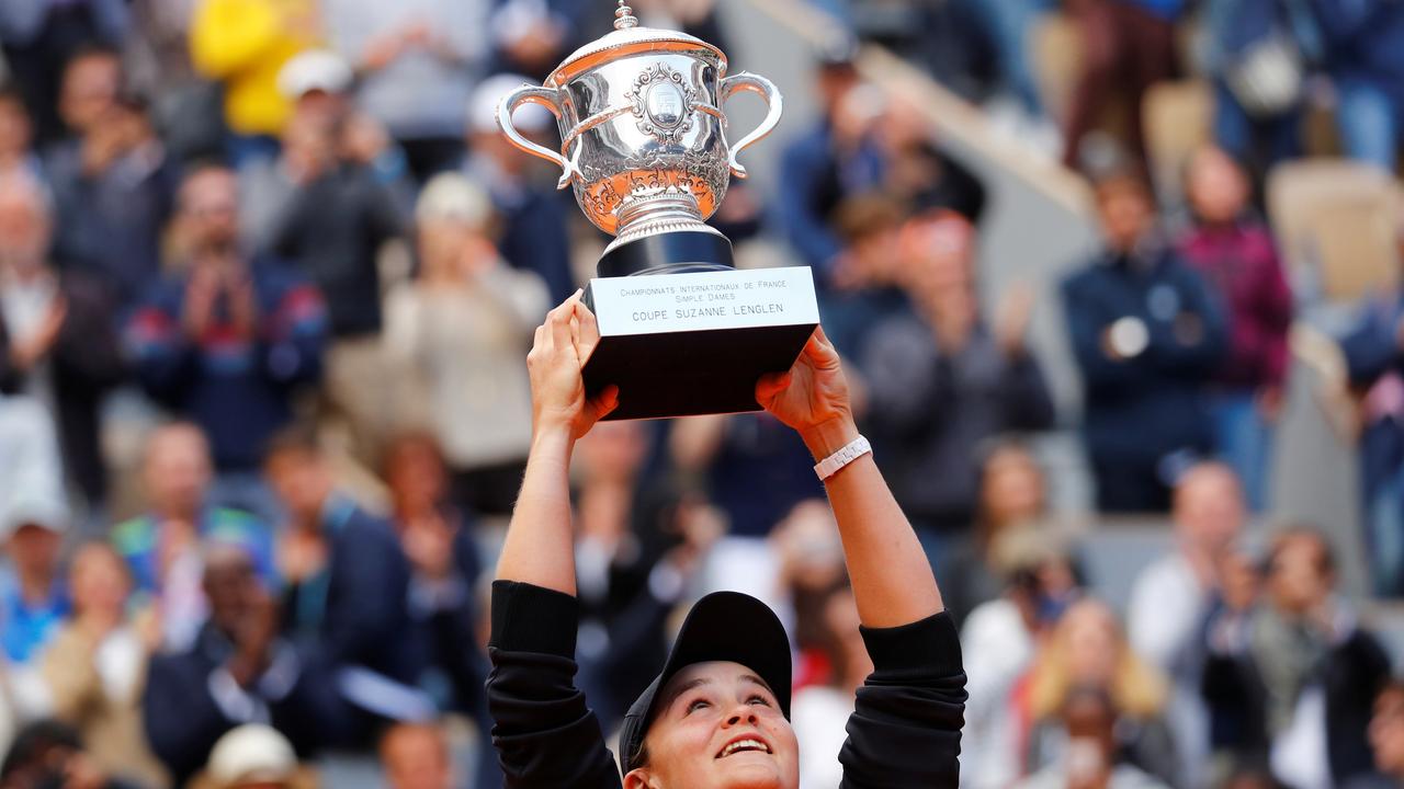 Ash Barty holds the French Open triophy aloft in 2019.