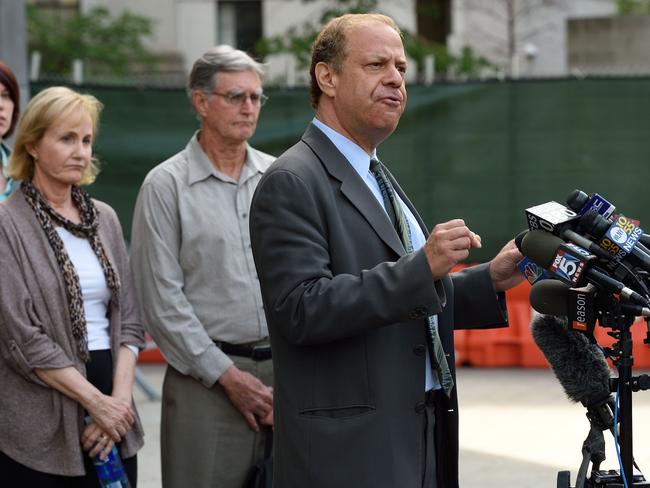 Ross Ulbricht's lawyer Joshua Dratel (R) speaks to reporters as Lyn (C) and Kirk (2nd R) Ulbricht, parents of Silk Road founder Ross Ulbricht, listen outside the Federal Courthouse.
