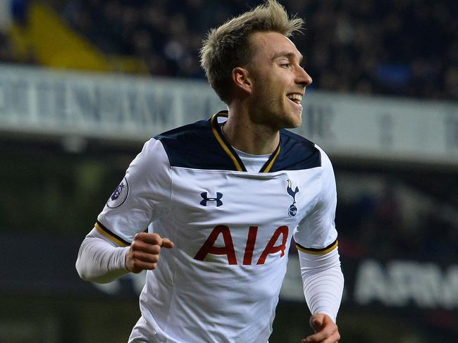 Tottenham Hotspur's Danish midfielder Christian Eriksen celebrates scoring his team's first goal during the English Premier League football match between Tottenham Hotspur and Hull City at White Hart Lane in London, on December 14, 2016. / AFP PHOTO / Glyn KIRK / RESTRICTED TO EDITORIAL USE. No use with unauthorized audio, video, data, fixture lists, club/league logos or 'live' services. Online in-match use limited to 75 images, no video emulation. No use in betting, games or single club/league/player publications. /