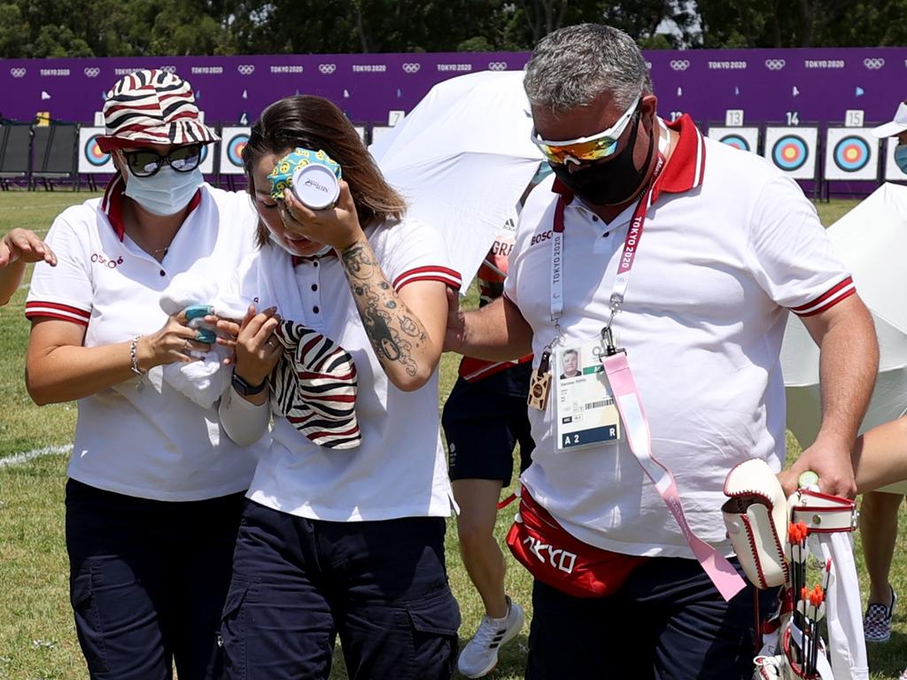 Russian archery competitor, Svetlana Gomboeva, is treated for heat exhaustion in the Women's Individual Ranking Round. Picture: Getty Images