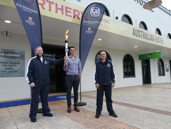 Runners Ben Hunt (left) and Sophie Thomson (right) passed the tap torch to owner Jackson Quinn at The Australian Hotel in Ballina.